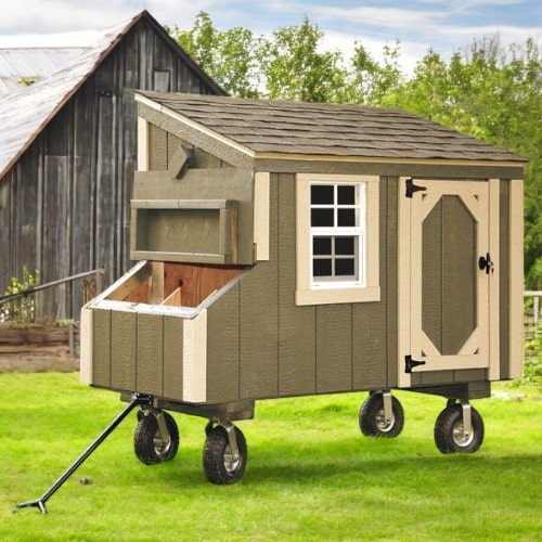 Small_Backyard_Chicken_Coop_front_view_with_wheel_add_on_placed-in-grassy-field